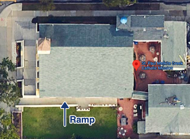 Aerial view of the church with an arrow marking the ramp on the south side, next to the lawn